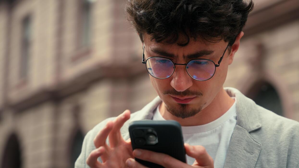 pensive-traveler-tourist-confused-ethnic-hispanic-man-using-mobile-phone-map-navigation-searching-address-navigator-application-online-lost-in-city-smartphone-location-looking-around-guy-male-outdoors-video.jpg